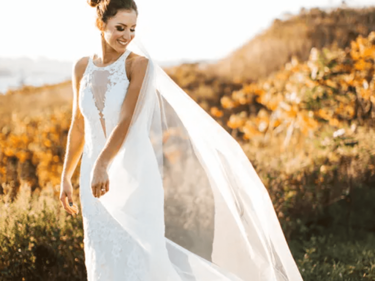 a person that is standing in the grass